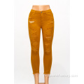 Aangepaste oranje jeans mode -persoonlijkheid